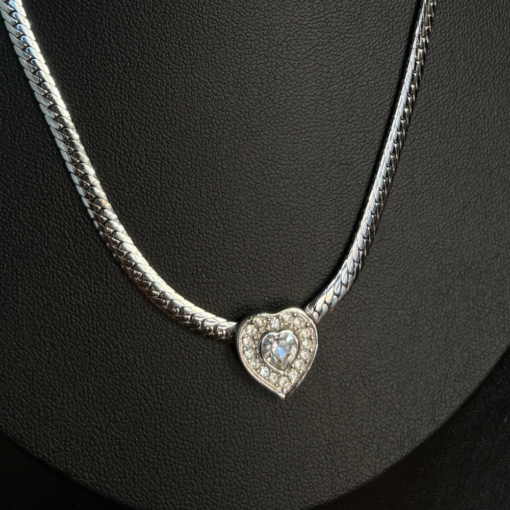 Vintage 80s Christian Dior silver tone heart necklace with herringbone chain.